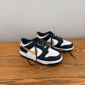 Nike Dunk Low sneakers in Gray / White with Metallic Gold Swoosh – Youth 6.5Y